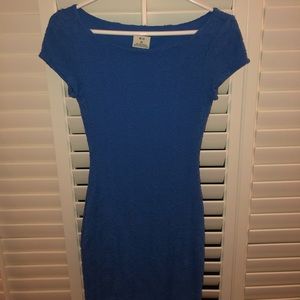 Blue body con dress with flower detailing